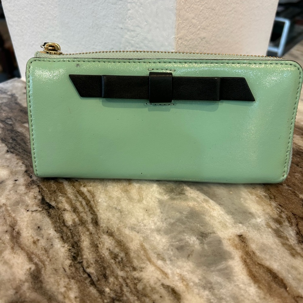 Kate Spade Chelsea park mint Wallet with Bow Accents has wear stains